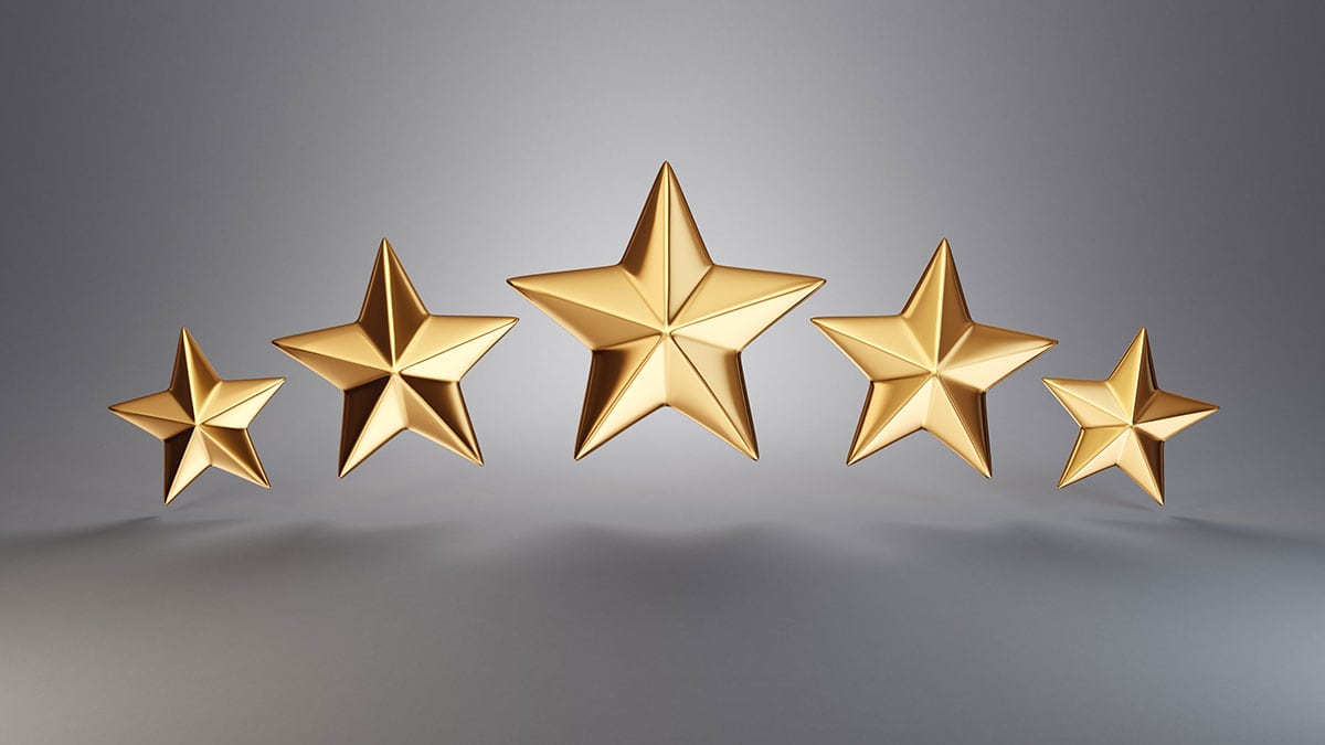 Five Golden Stars Hovering in Front of a Silver Backdrop