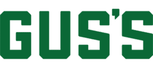 The Word “Gus’s” In Bold, Uppercase, Green Block Letters On A White Background.