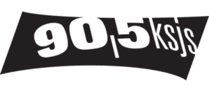 Black And White Logo Displaying “90.5 Ksjs” In Bold, Stylized Letters On An Uneven, Wavy Black Background.