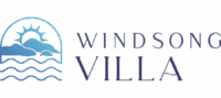 Logo For Windsong Villa With A Stylized Sun Rising Over Mountains And Ocean Waves, Next To The Words “Windsong Villa” In Elegant Blue Lettering.