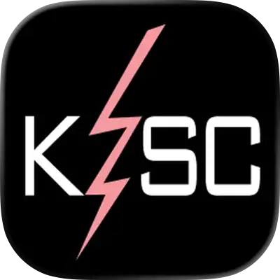 Black Square Logo With The White Letters “Ksc” And A Pink Lightning Bolt Running Diagonally From The Top To The Bottom, Intersecting The “K” And Separating The “S” From The “C.”.